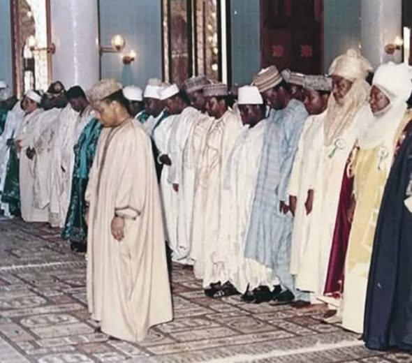 Throwback Picture Of IBB Leading Prayer With Abacha As Mu’adhdhin